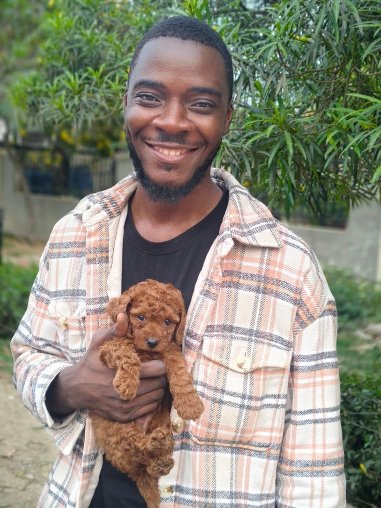Happy customer with Toy Poodle